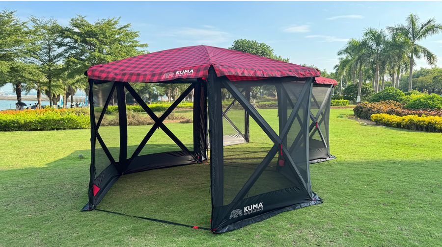 Photo of folding camp gazebo on grassy lawn.